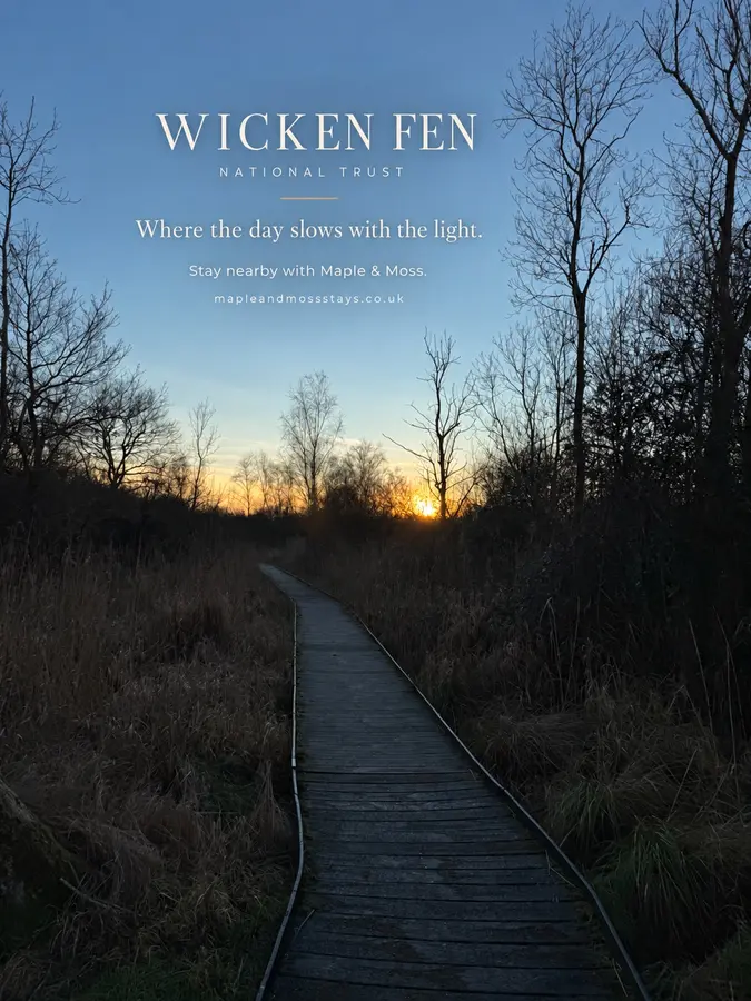 Sun setting across the reedbeds and water at Wicken Fen, with Wicken Fen title lettering
